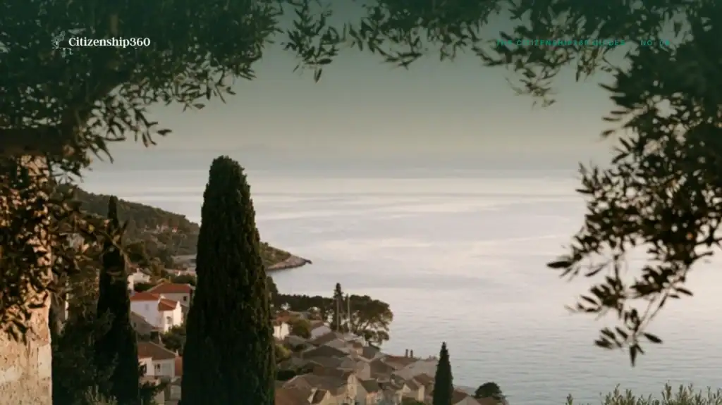 | Citizenship 360 a Mediterranean Coastal Town at First Light Seen Through Olive Branches from the Cover of the Citizenship360 Guide to Retiring in Europe